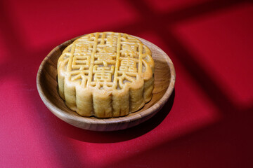 A traditional mooncake with the text 