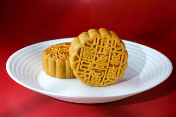 Two traditional mooncake with the text 