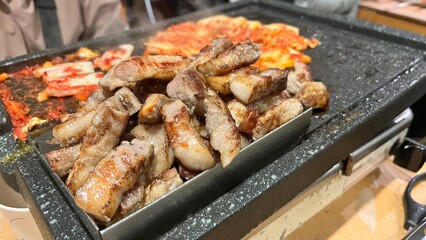 grilled meat on the grill with kimchi