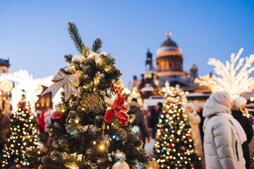 New Year and Christmas in Russia, glowing decor decoration in a winter snowy street, with night decor illumination, city outdoor decorations, Saint-Petersburg, christmas tree and garland light