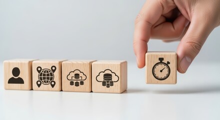 Hand placing stopwatch cube next to cloud data and location blocks wooden blocks timer