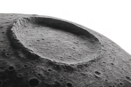 Moon surface showing large impact crater