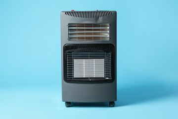 One electric heater on light blue background