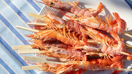 Succulent shrimp skewers glistening under sunlit embrace, embodying maritime culinary art, perfect for Yule feasts or Midsummer revelries