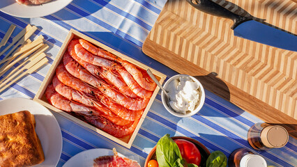 Sunlit seafood feast unveils rustic allure, evoking Mediterranean summers and La Feria de Abril's...