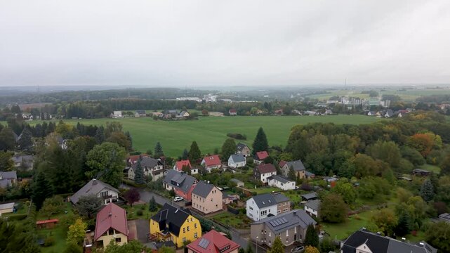 Aerial Freiberg Germany homes neighborhood farms. City center rural travel in eastern Germany. Historical buildings and landmarks. Urban historic center of East Germany. Total destruction in WW II.