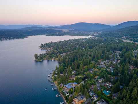 Aerial landscape of Lake Washington forest and mountains at sunset Bellevue suburb of Seattle WA