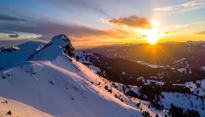 Majestic sunrise over snow-covered mountain range