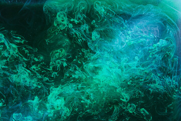 Abstract green blue background. Moving flow of multicolored paints, colorful fluid liquid art