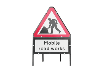 Men at work, Mobile road works temporary triangular road sign isolated, front view