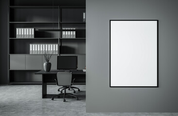 Blank vertical poster frame on gray wall in modern office interior with minimal furniture, shelves and clean layout. Concept of design presentation. 3D Rendering