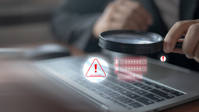 Cybersecurity alert concept showing magnifying glass examining laptop with login warning, password protection, and data breach risk in modern office background.