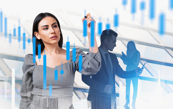 Confident woman drawing stock chart, two professionals analyzing data, creative composite style, futuristic office background, finance concept