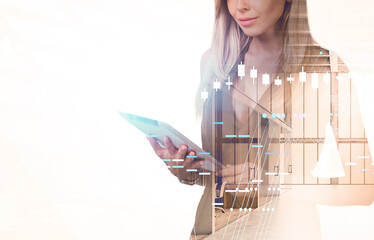 Woman holding tablet with abstract financial chart overlay, creative style, in bright modern office interior. Concept of finance and technology