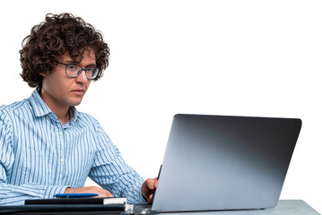 Concentrated man with curly hair and glasses using laptop at desk, wearing striped shirt, on white background, concept of productivity and creative work