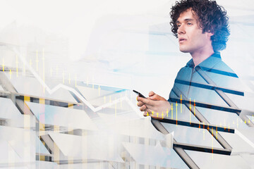 Focused businessman using smartphone with financial chart overlay, creative double exposure style on white background, concept of investment and strategy