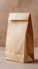 Brown paper bag standing on neutral background for sustainable packaging