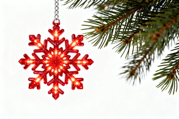 Red snowflake ornament on tree branch