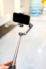 Using a smartphone gimbal for stable video recording in bright indoor space