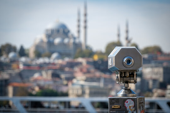 A tourist telescope in Istanbul showing old town and historic mosques in the background.