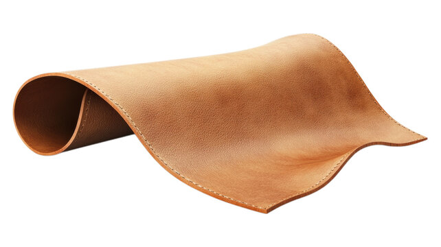 A piece of light brown leather curled on a black surface on transparent background