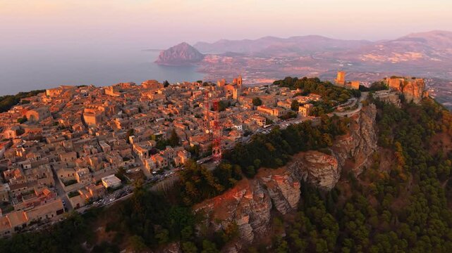 Tyrrhenian Coastline And Mount Cofano From Ancient Village Of Erice At Sunset In Sicily, Italy. - aerial shot