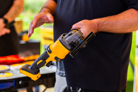man holding angle grinder tool talking about safe operating practices