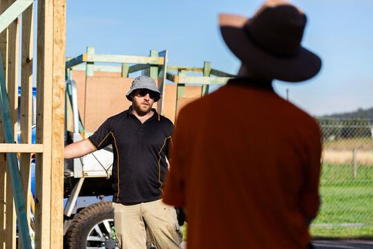 Instructor teaching building course to young trade apprentices with hands on learning