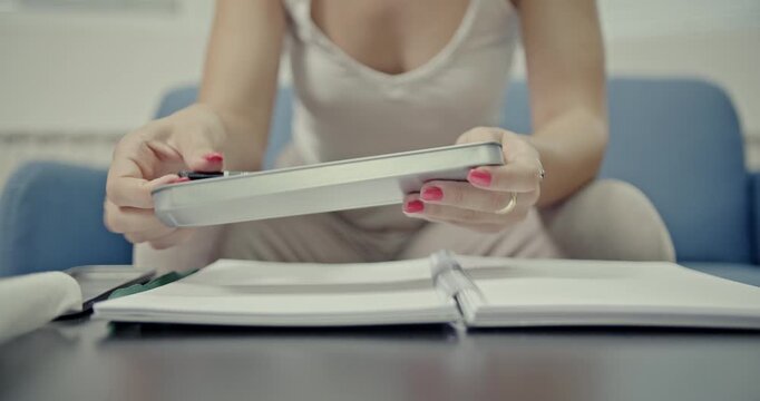 Close-up of a woman's hands generating satisfying ASMR sounds by tapping pencils and opening a metal pencil case. A perfect audio-visual experience for focus, relaxation, or creative projects.