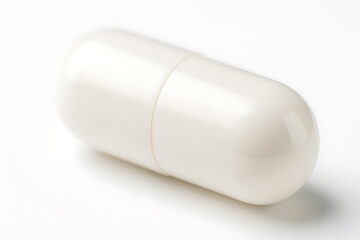 A close-up of a glossy white capsule pill on a soft white background, highlighting its smooth surface, clean design, and minimalist pharmaceutical aesthetic under gentle lighting.
