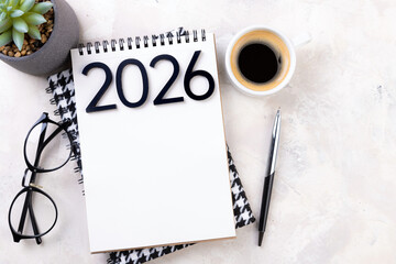 New year resolutions 2026 on desk. 2026 goals list with notebook, plant on colorful background. Resolutions, plan, goals, action, checklist, idea concept. New Year 2026 resolutions, copy space