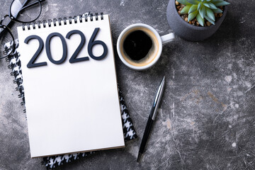 New year resolutions 2026 on desk. 2026 goals list with notebook, plant on colorful background. Resolutions, plan, goals, action, checklist, idea concept. New Year 2026 resolutions, copy space