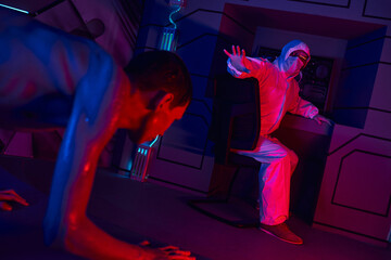 Scientist conducts vital examination of extraterrestrial being in high tech laboratory
