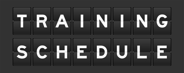 Black color analog flip board with word training schedule on gray background