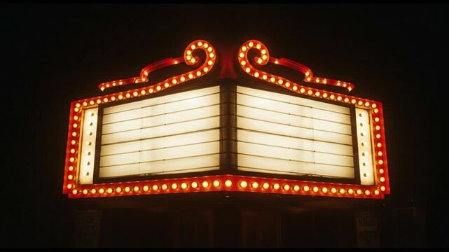Vintage theater marquee glowing at night