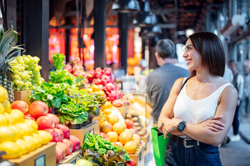 Woman shopping for fresh produce at local market