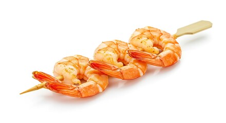 A skewer of grilled shrimp rests on a white surface showcasing their cooked texture and orange hue