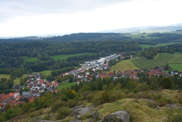 Ancient castle ruins overlooking picturesque village in bavarian forest