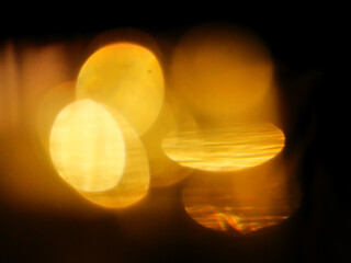 Orange gold color light leaks on dark background. Abstract background for special effects and design. Random colorful shapes.