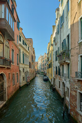 Charming Venetian canal view with colorful buildings.