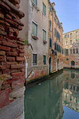Venetian canal with historic reflections.