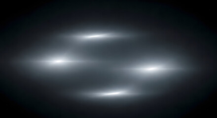 Obraz premium Abstract blurred light streaks and bokeh over dark grayscale background
