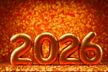 Happy New Year 2026 party celebration. Merry Christmas background. 3d gold number balloons in studio with confetti on red backdrop.