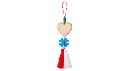 Isolated Romanian Martisor decoration, handmade talisman with a heart and good luck charms
