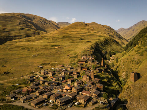 Aerial view of the ancient village of Dartlo nestled in the rugged Tusheti mountains, a tapestry of earthy hues and stone structures, Dartlo, Kakheti, Georgia.