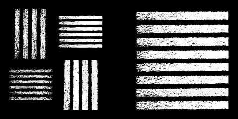 Collection of textured white chalk lines and stripes on a black background for graphic design