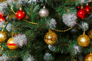 Festively decorated Christmas tree with gold and red ornaments