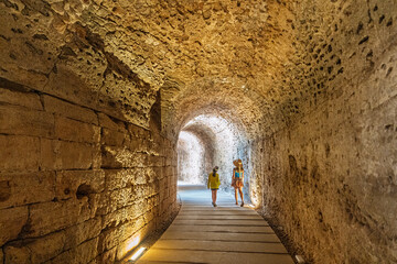 Mom and daughter, on summer vacation, in Spain, in the underground section of the Teatro Romano de C&aacute;diz or Roman Theater of C&aacute;diz.  