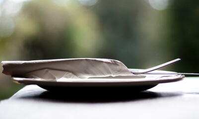 Elegant minimalist dining setup with soft natural light