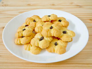 Plie of butter cookies with raisin